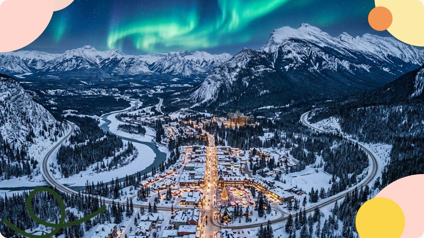 Beleuchtetes Bergdorf in einem verschneiten Alpental in Kanada im Winter