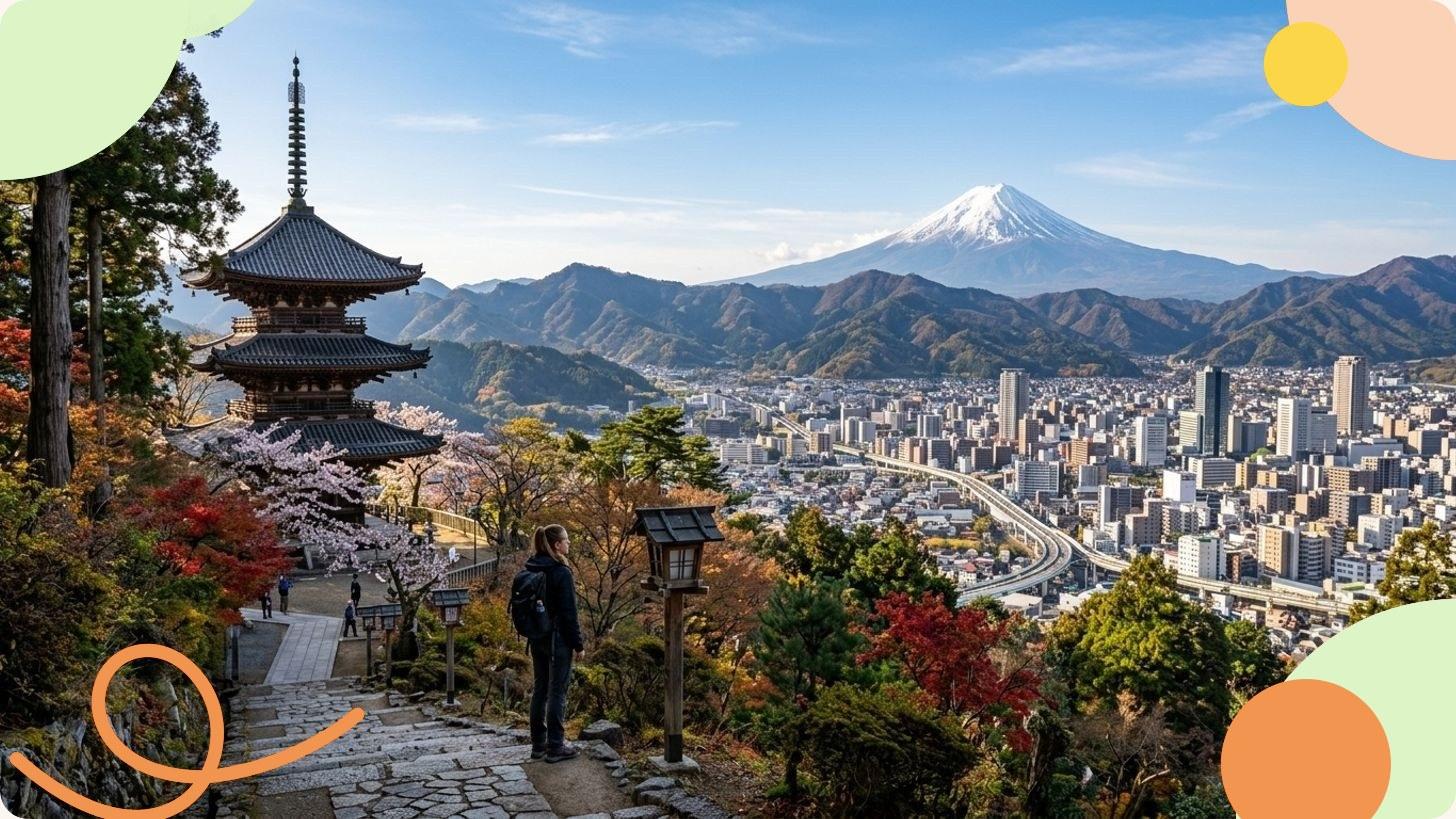 Vue aérienne d'une métropole japonaise illuminée au crépuscule, avec une tour rouge dominant les gratte-ciel et la baie