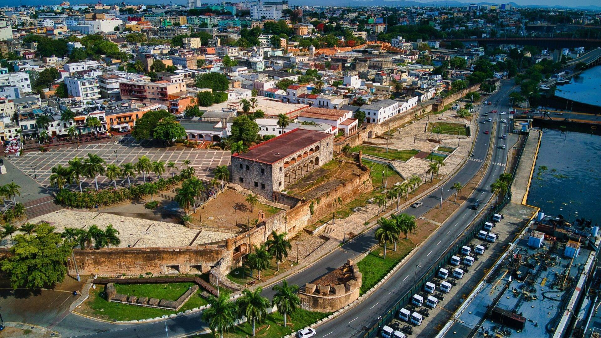 Cobbled street lined with colourful colonial buildings in Santo Domingo’s Ciudad Colonial