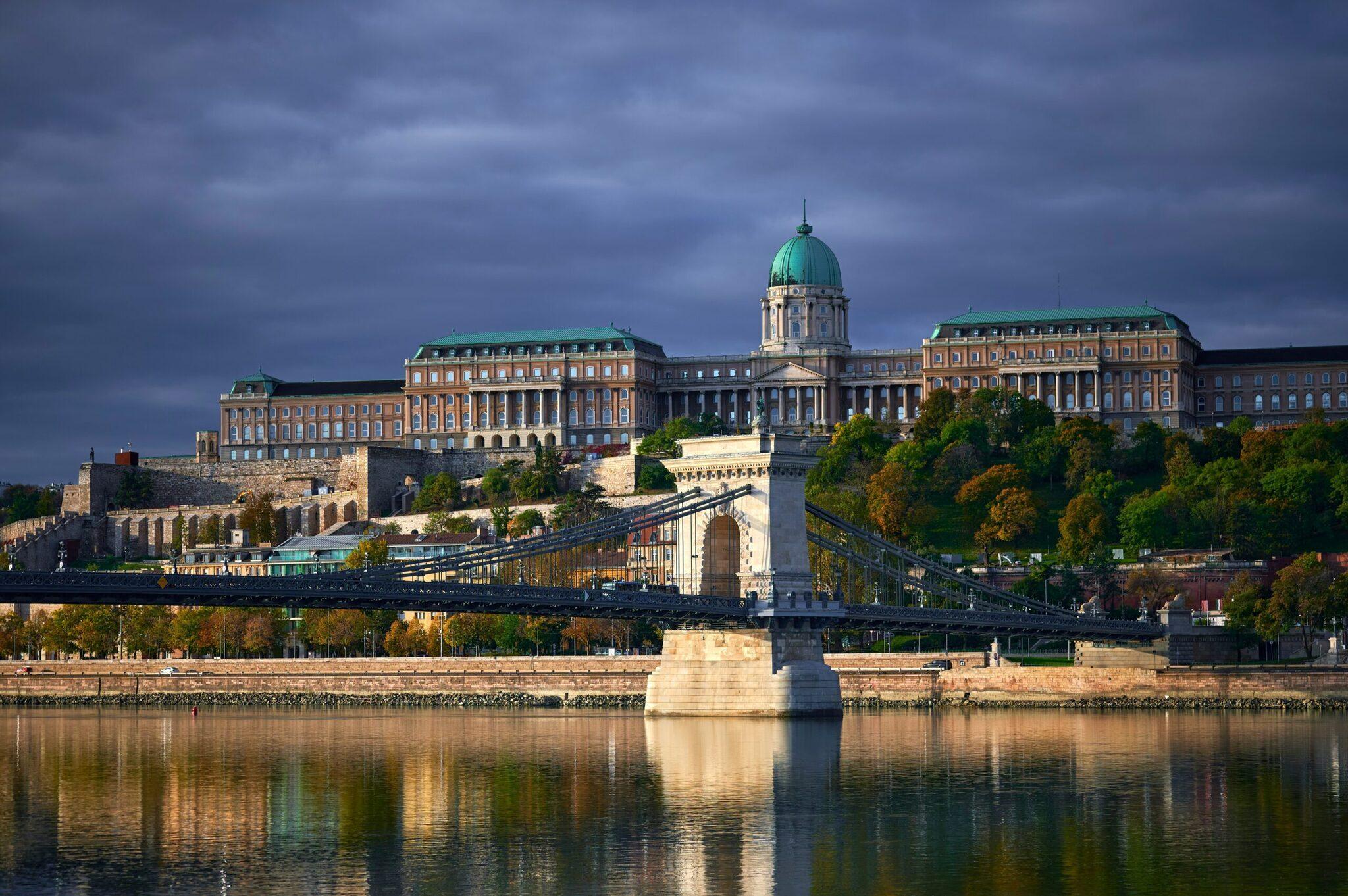 Castle Hill dominating the Danube with the Chain Bridge and historic Pest buildings stretching into the background