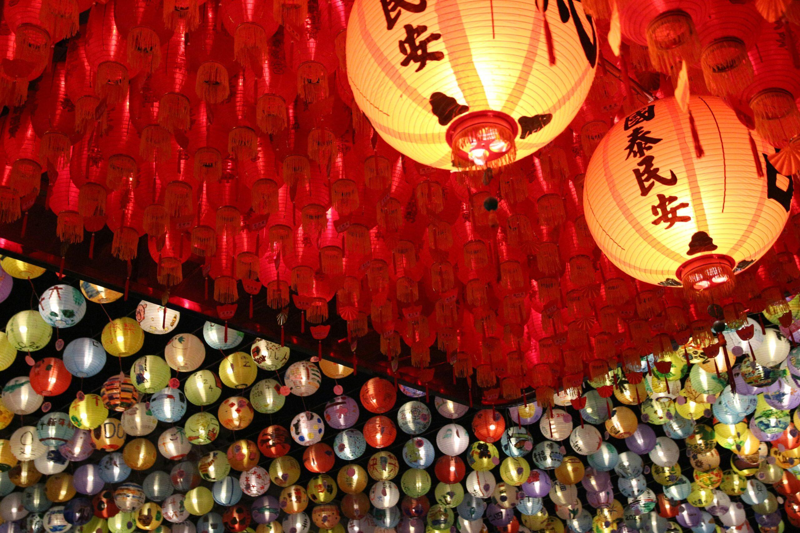 Thousands of glowing lanterns rising into the night sky at the Pingxi Lantern Festival in Taiwan