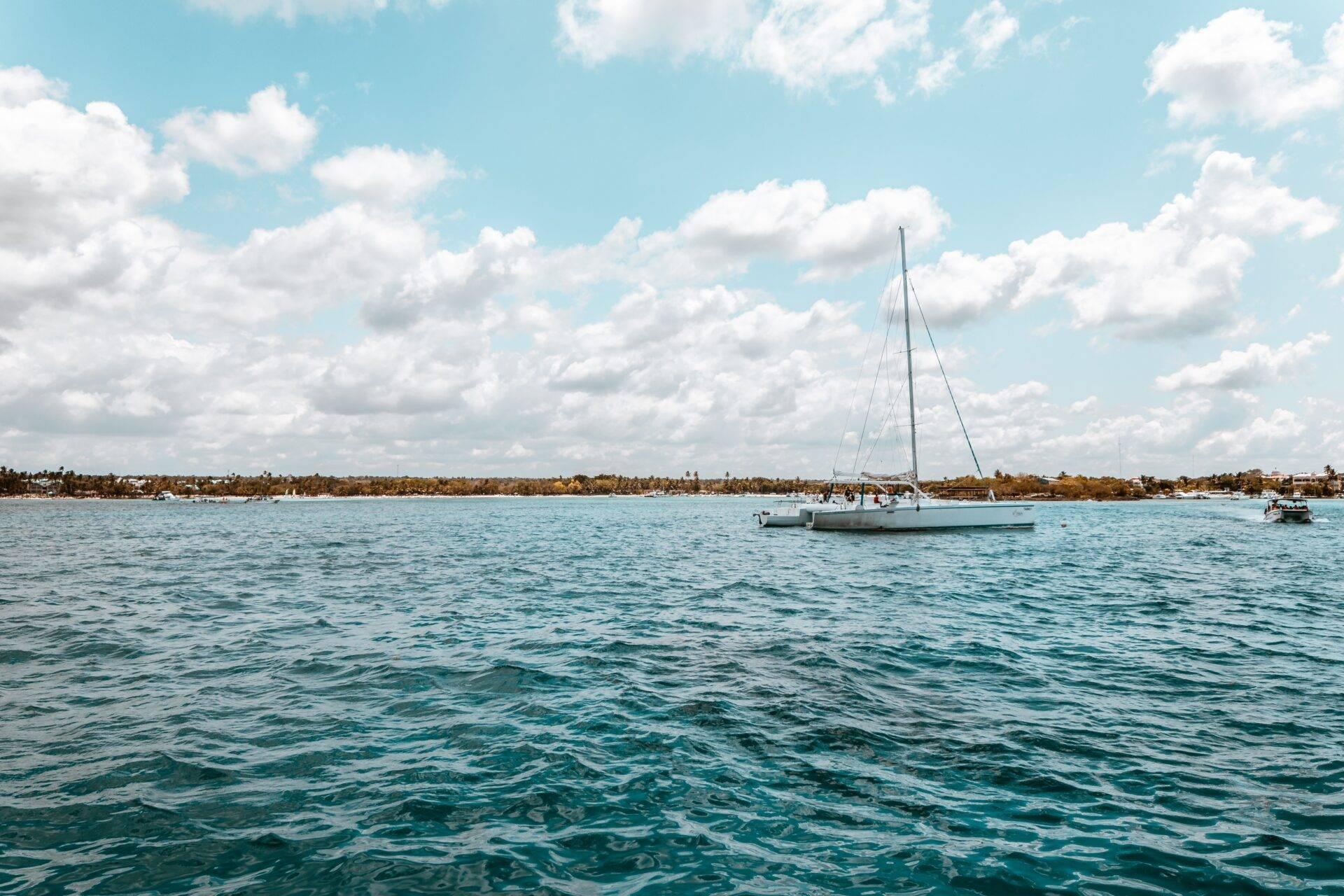 Colourful fishing boats moored in the calm waters of the coastal village of Bayahibe